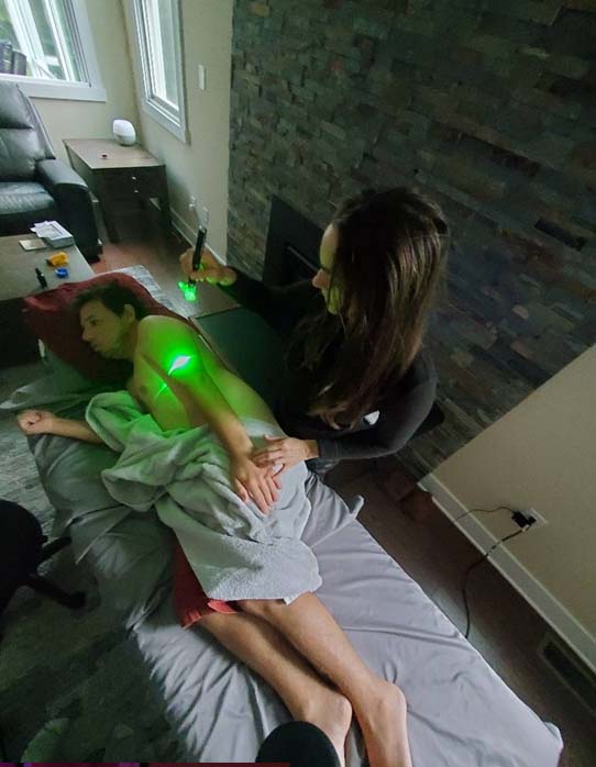Rachel Celler administering green laser therapy